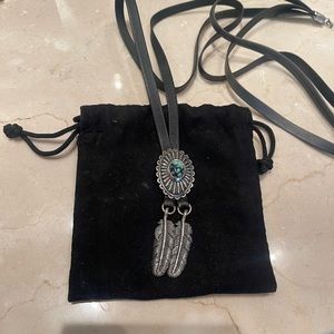 King Baby Studio leather bolo.  Sterling silver feathers and turquoise.
